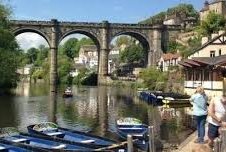 Knaresborough Waterside - small blue boats, a river and viaduct